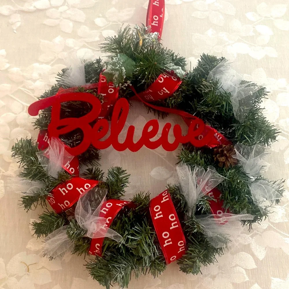 Winter holiday wreath with ho ho ho & BELIEVE adornments evergreen base